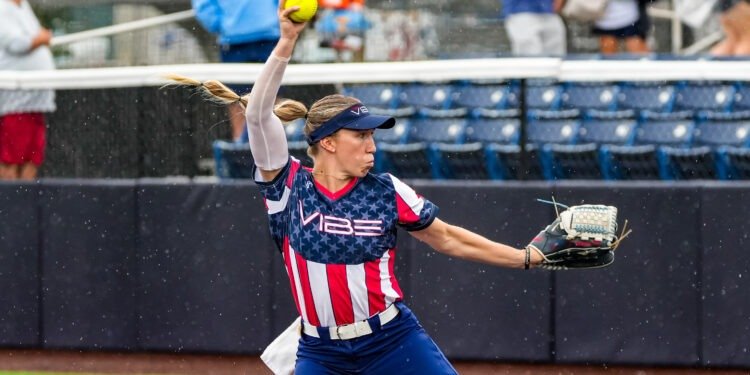 Softball player pitches