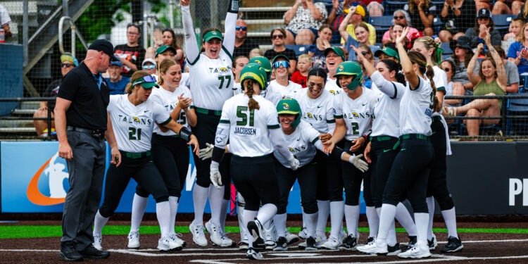 team meets at home plate after a home run.