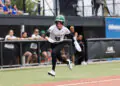 Talons player running from third.