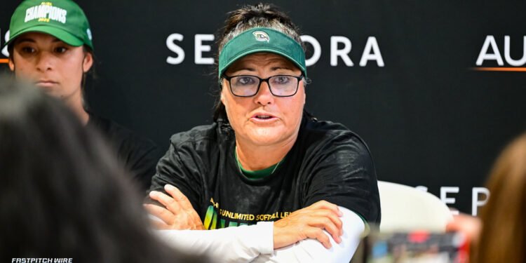 Talons Lisa Fernandez in black shirt and green visor.