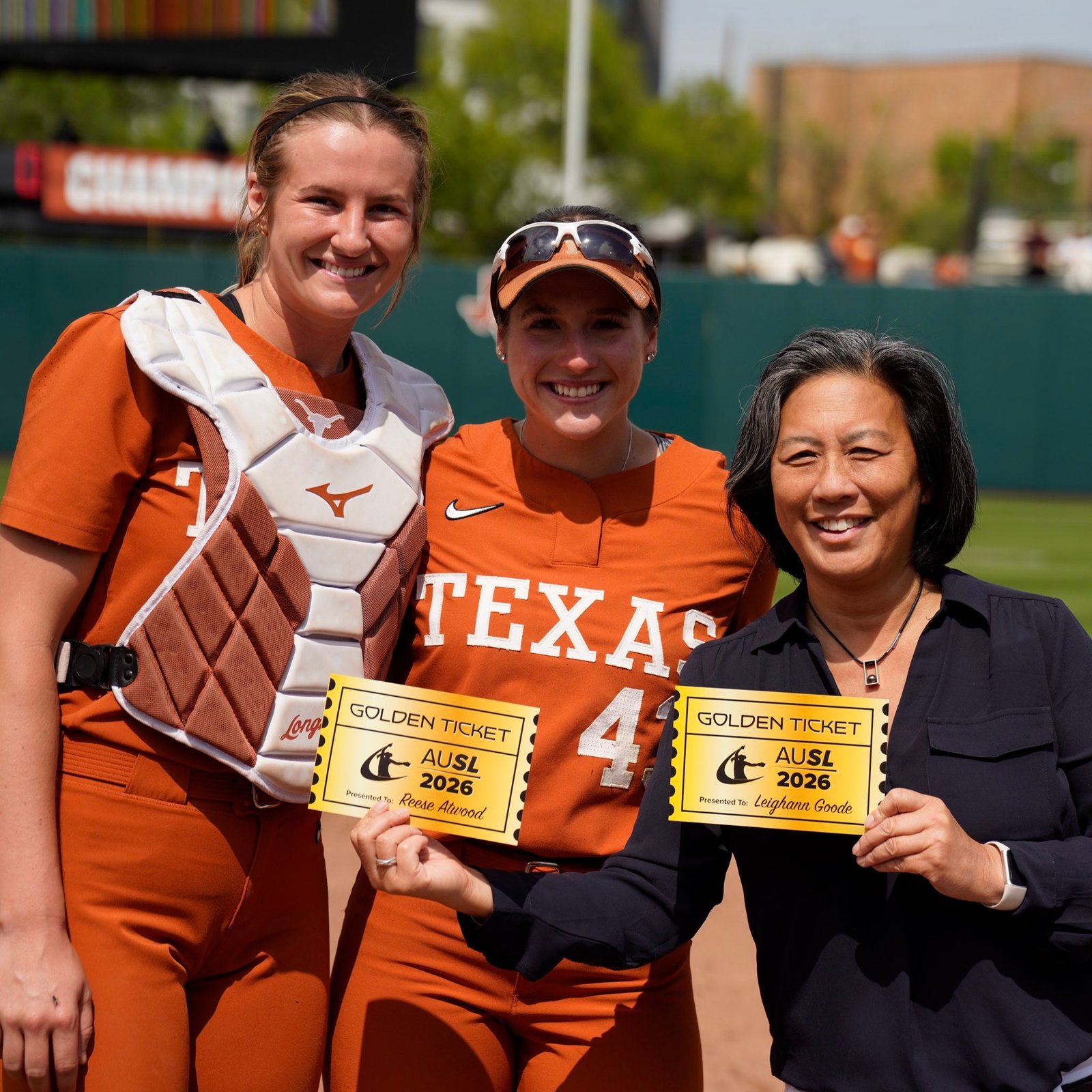 AUSL commissioner Kim NG presented Reese Atwood and Leighann Good their Golden Tickets. (Photo AUSL)